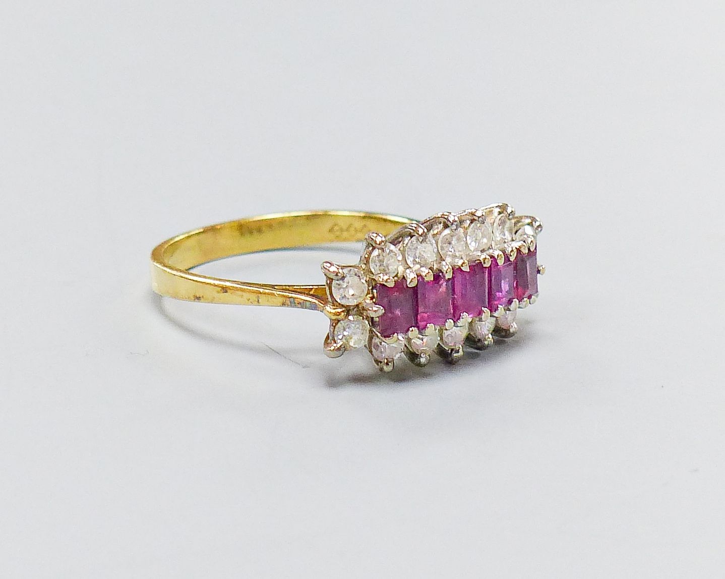 A modern 18ct gold, ruby and diamond half hoop cluster ring, size Q, gross weight 4.5 grams.